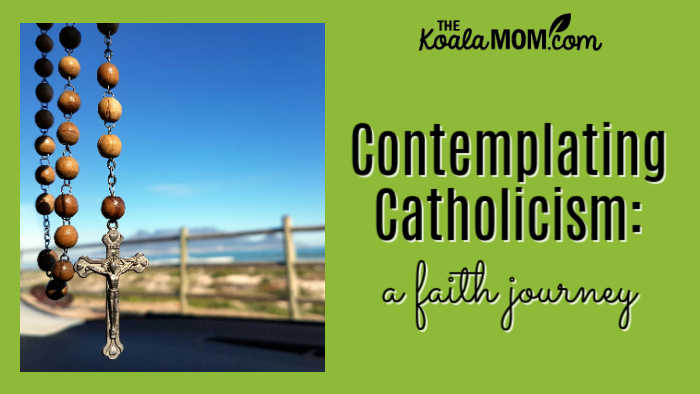Contemplating Catholicism: a faith journey. Photo of rosary in focus and blurry landscape background by Pixabay.
