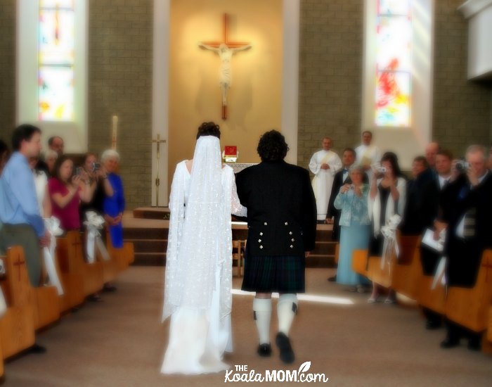 Bride and groom walking down the aisle together on their wedding day.