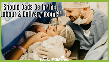 Should Dads Be in the Labour & Delivery Room? Photo of mom and dad in scrubs, holding newborn baby by Jonathan Borba via Pexels.