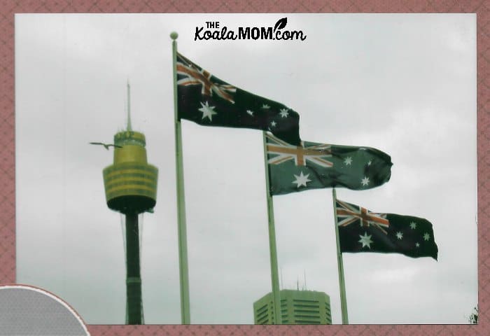 Australian flags flying in front of the Sydney Tower.