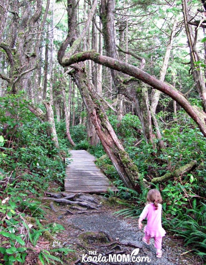 Toddler in pink running along the Botanical Beach Trail.