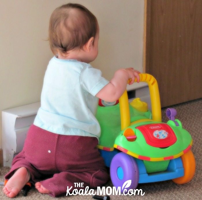 Baby milestones: learning to crawl with the help of a toy