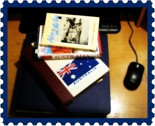 Photo of my Australia journal, scrapbook, guidebook and Alice... on the Line sitting near my computer as I prepare to start writing.