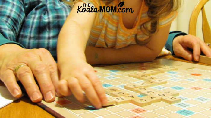 3-year-old Sunshine helps Grandma play Scrabble, because board games with preschoolers is fun!