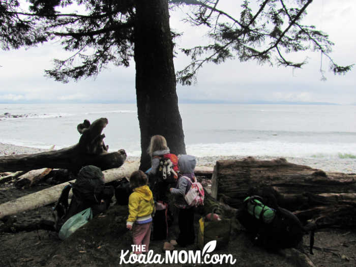 Three kids hanging out on Sombrio Beach. Photo by Bonnie Way.