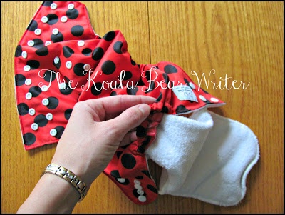 Kawartha Cloth diapers are affordable Canadian pocket diapers that come in cute colours, like the "ladybug diaper" shown here with the microfiber insert.