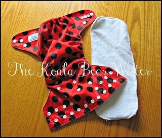 Kawartha Cloth diapers are affordable Canadian pocket diapers that come in cute colours, like the "ladybug diaper" shown here with the microfiber insert.
