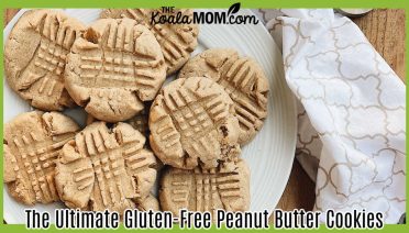 The Ultimate Gluten-Free Peanut Butter Cookies. Delicious homemade peanut butter cookies arranged on a white plate with baking utensils on a wooden surface. Photo by Jessica Davis via Pexels.