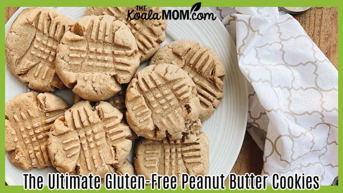 The Ultimate Gluten-Free Peanut Butter Cookies. Delicious homemade peanut butter cookies arranged on a white plate with baking utensils on a wooden surface. Photo by Jessica Davis via Pexels.