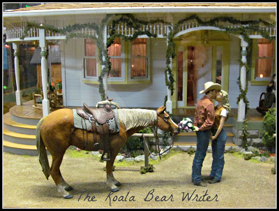 Cowboy kissing a girl at Miniature World