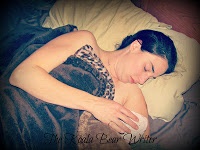 Bonnie Way with her new baby, recovering in bed after her homebirth
