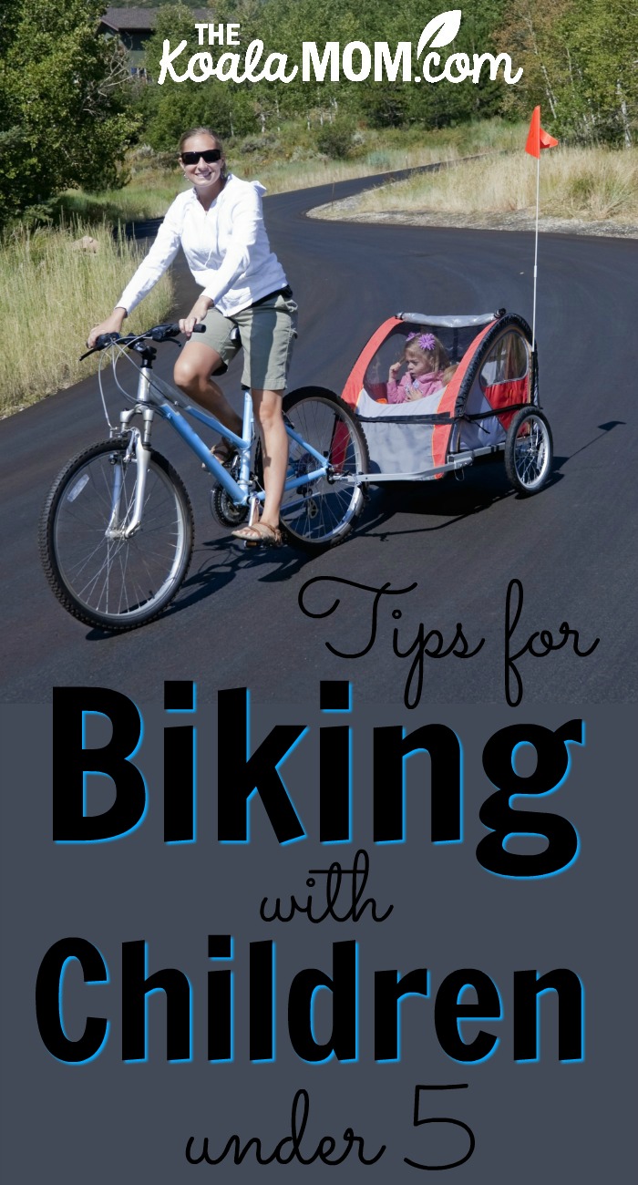 Tips for Biking with Children under 5 (mom on a bike with a child in a bike trailer behind her)