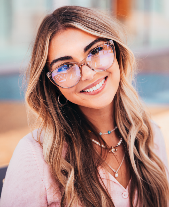 Pretty girl wearing a pair of eyeglasses from WearMePro.