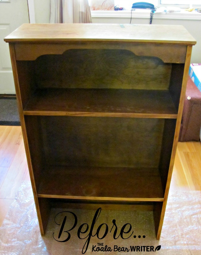 A brown wood bookshelf before chalk painting