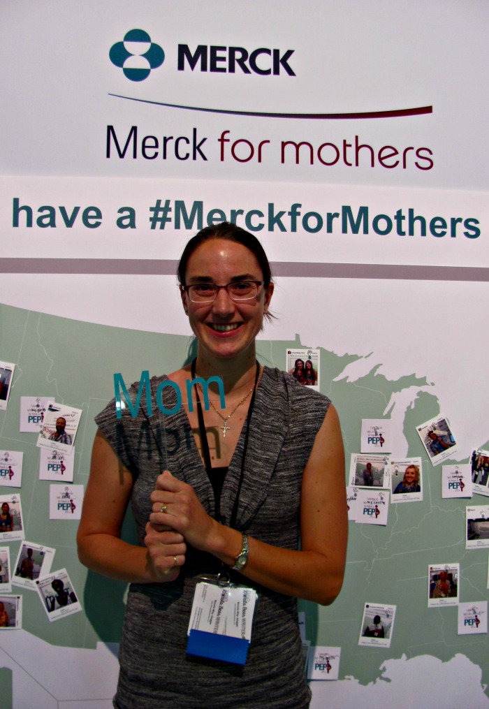 Bonnie Way posing at the Merck booth at BlogHer14