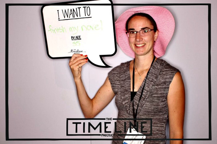 Bonnie Way posing at the TimeLine Project booth at BlogHer14 conference