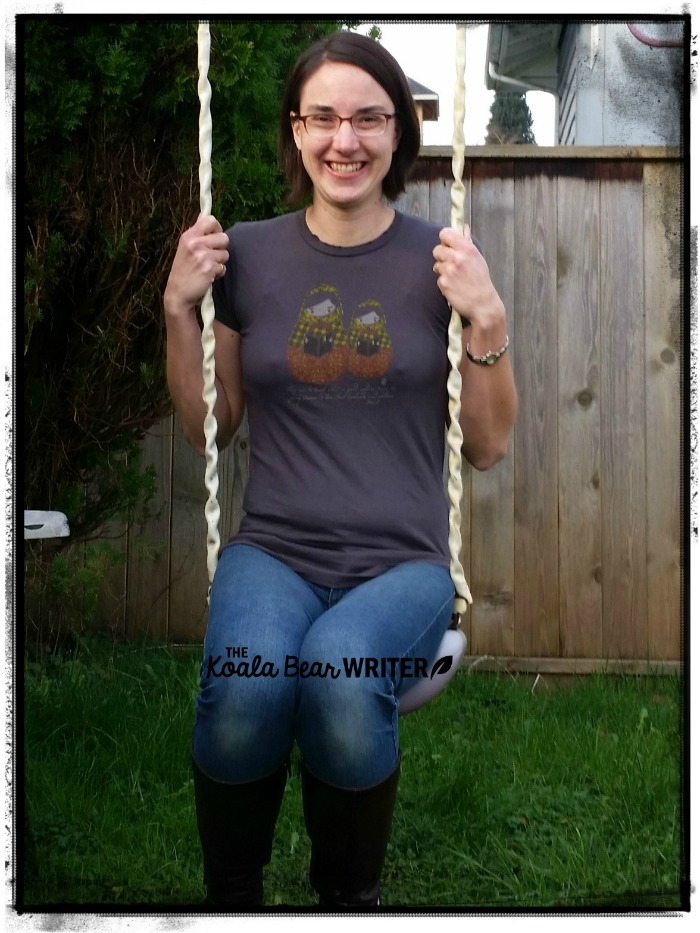Zoe Clothing Company lets families wear their faith! (woman on swing wearing a grey T-shirt)