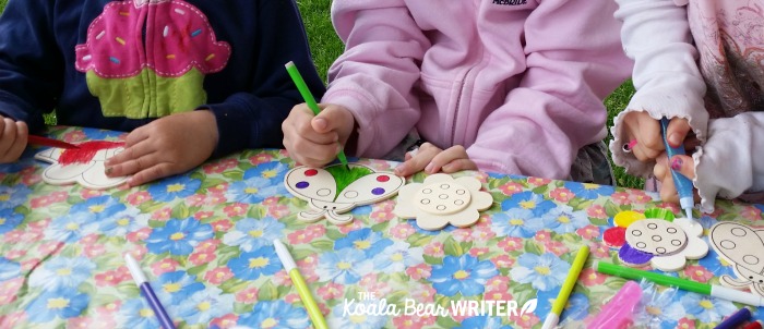 Colouring wood magnets.