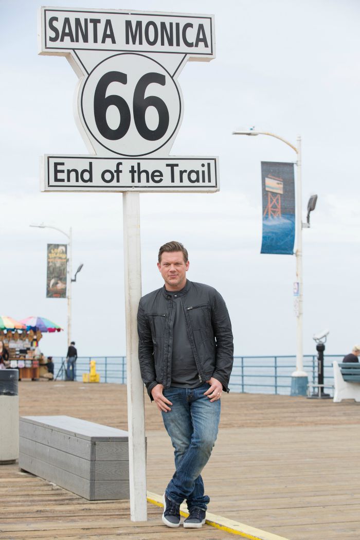 Host Tyler Florence opens up the show at the end of Route 66, in Santa Monica, California, as seen on Food Network's, The Great Food Truck Race, Season 6.