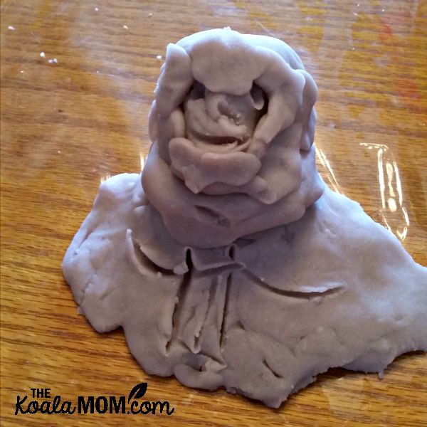 A playdough model of a girl in a snowsuit by my 5-year-old daughter