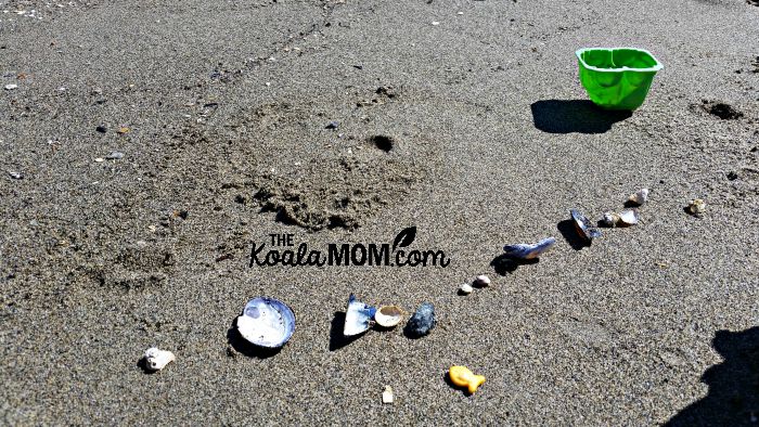 Shells and beach toys on the sand