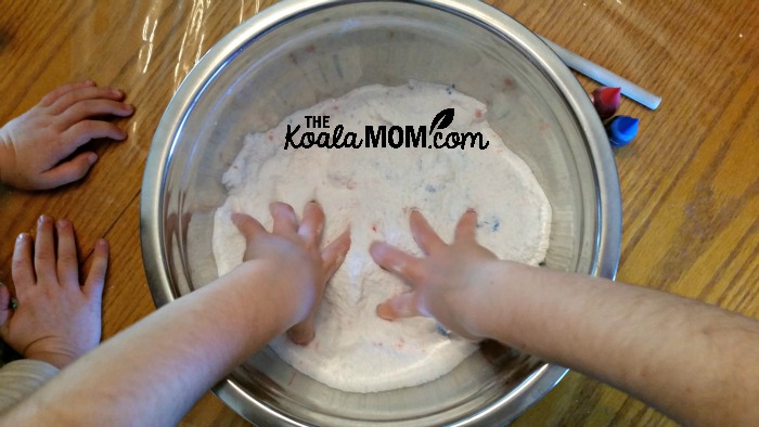 Kids mixing bath salts with their hands