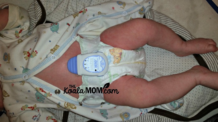 Snuza Hero monitor clipped on baby's diaper