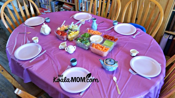 Table set for a purple birthday tea party