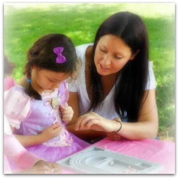 Esther doing a rosary bracelet workshop