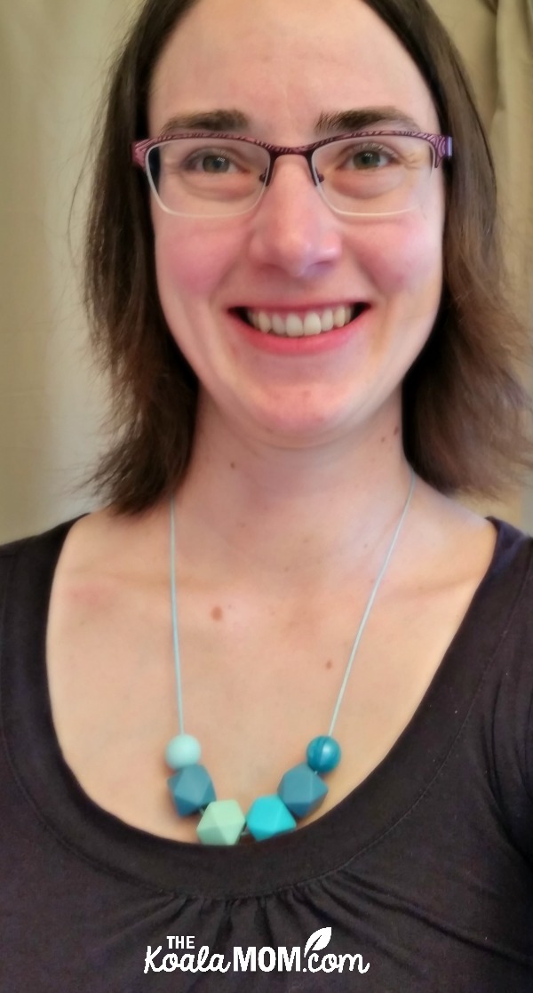 Bonnie Way wearing a teal teething necklace from Two Brothers and Olivia
