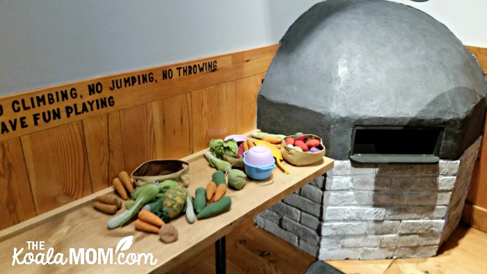 Indoor places to play in Vancouver - Kids' wood-burning oven and toy food at Rocky Mountain Flatbread