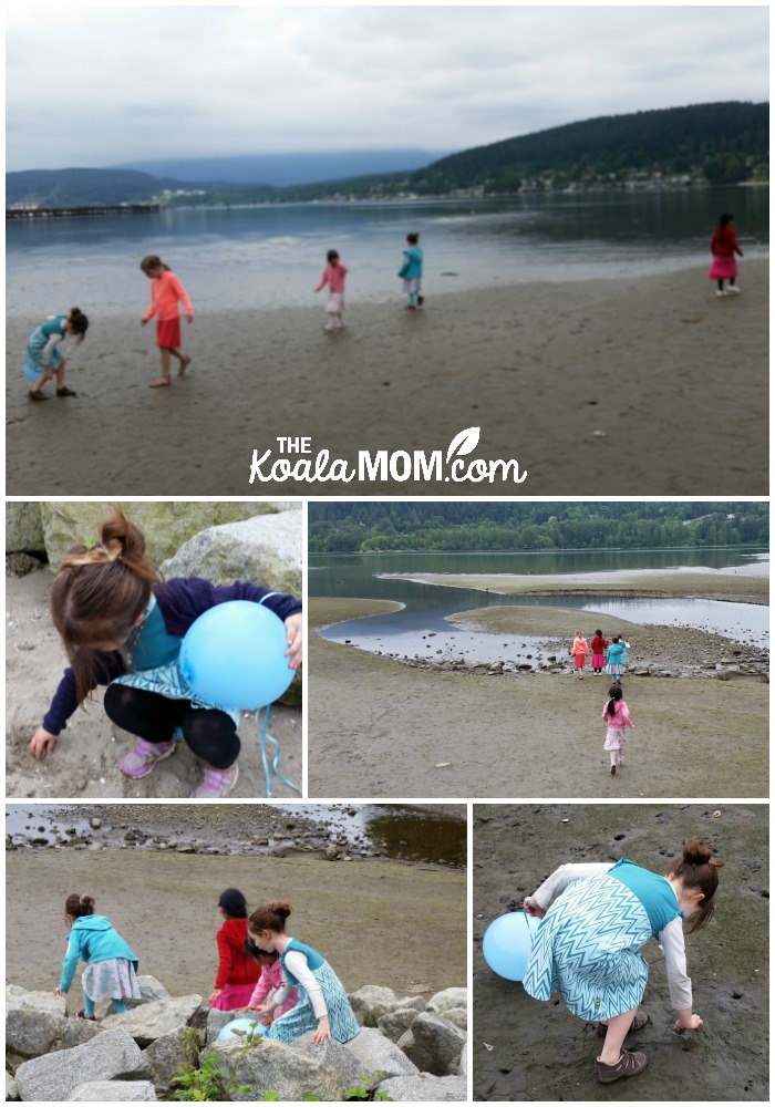 Girls playing at the beach together.