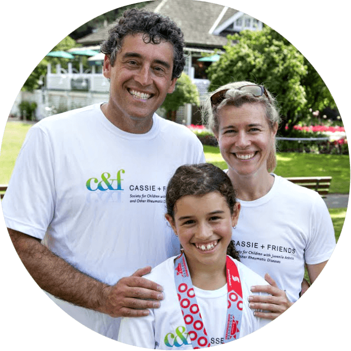 Cassie Porte with her parents, running to raise money for juvenile arthritis