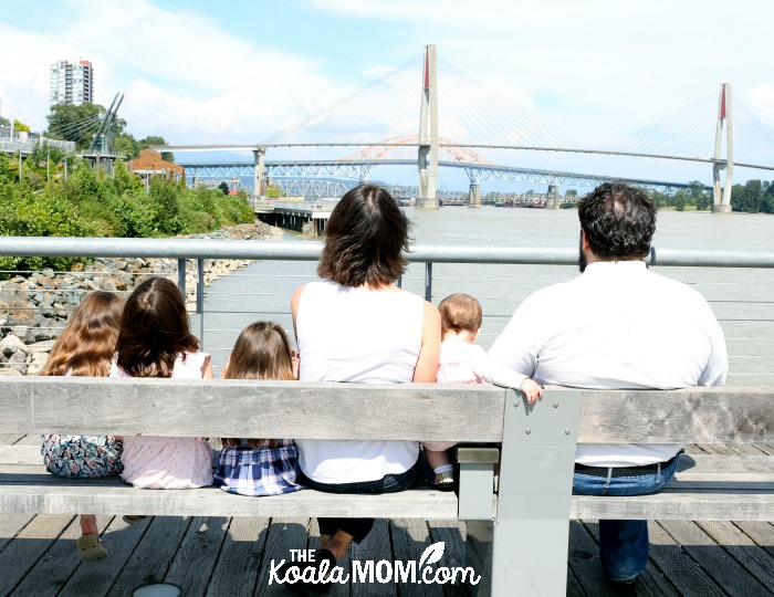 Way family sitting on a bench at New Westminster Pier Parkphoto by Memotime Photography