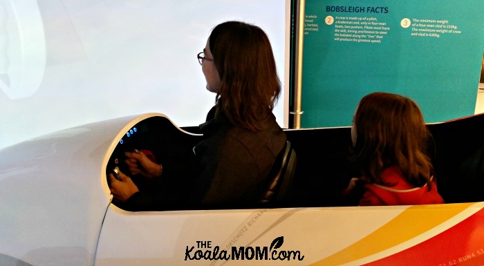 Riding the boblsleigh simulator at the Richmond Olympic Experience with our Kidsworld passes