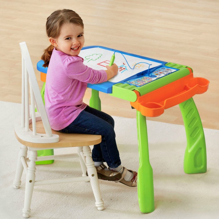 Girl drawing at a DigiArt Creative Easel, one of the VTech toys in my Christmas Gift Guide