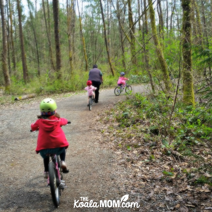 Our family biking together on a trail in Vancouver, BC