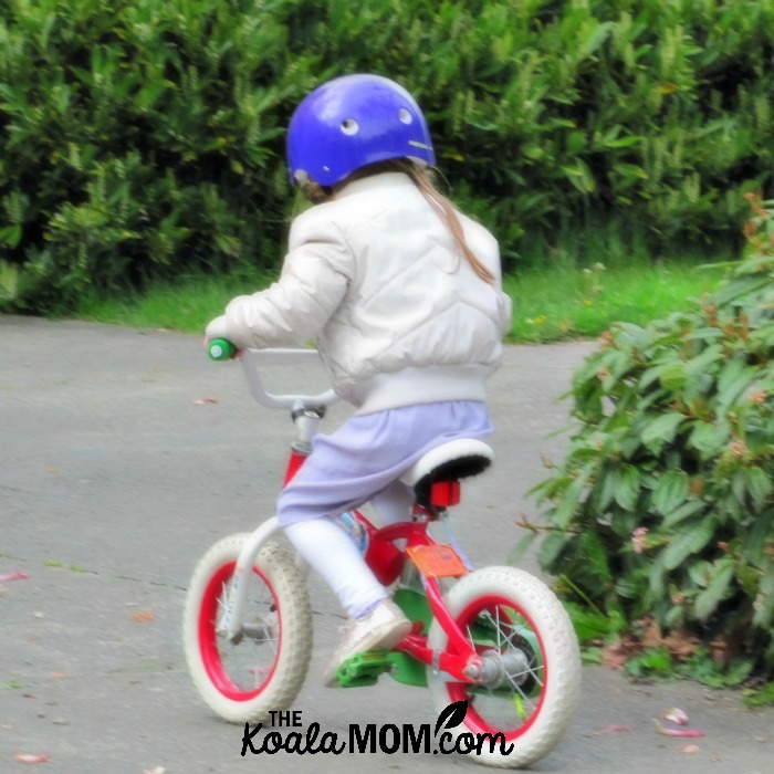 Sunshine as a toddler riding her bike