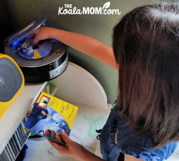 7-year-old Jade puts the Swan Lake CD in her CD player.