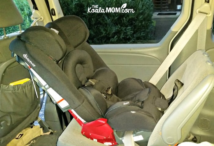 Rear-facing Diono Radian RXT car seat installed in a Dodge Grand caravan