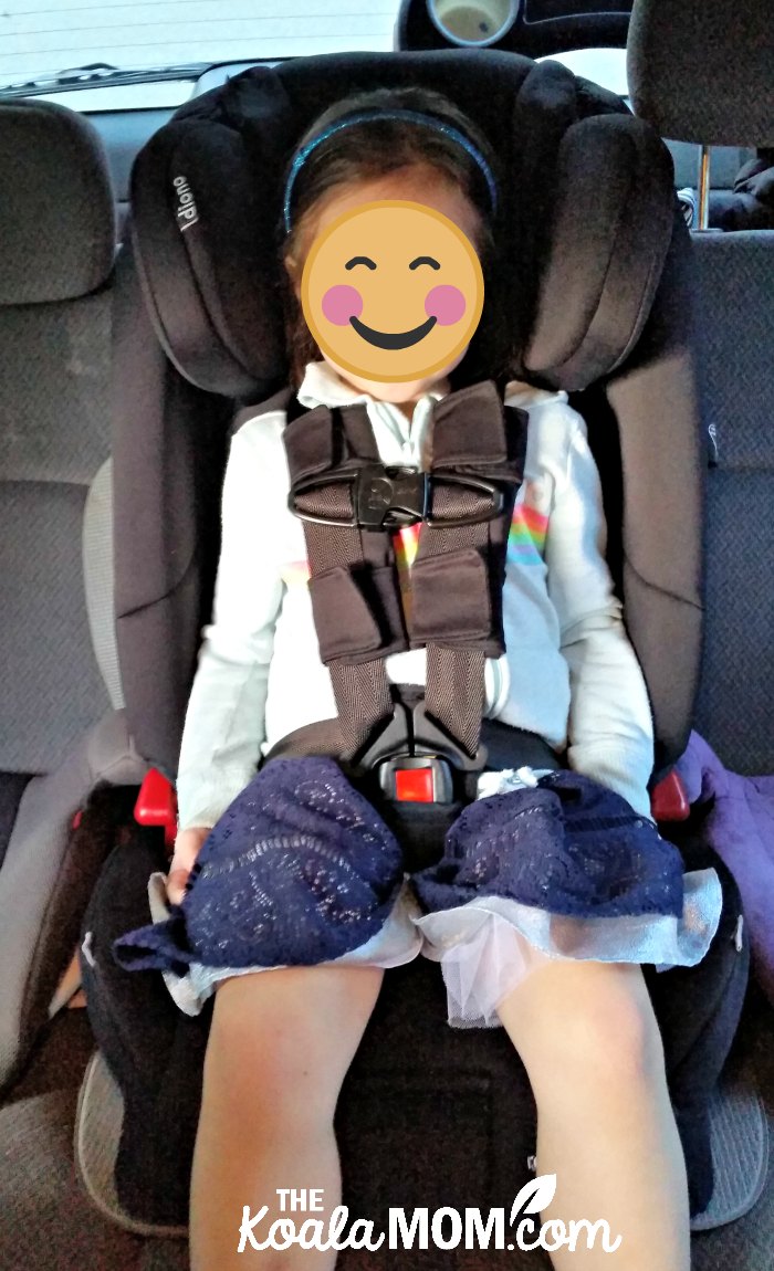 Four-year-old sitting in the Diono Radian RXT car seat with a five-point harness.