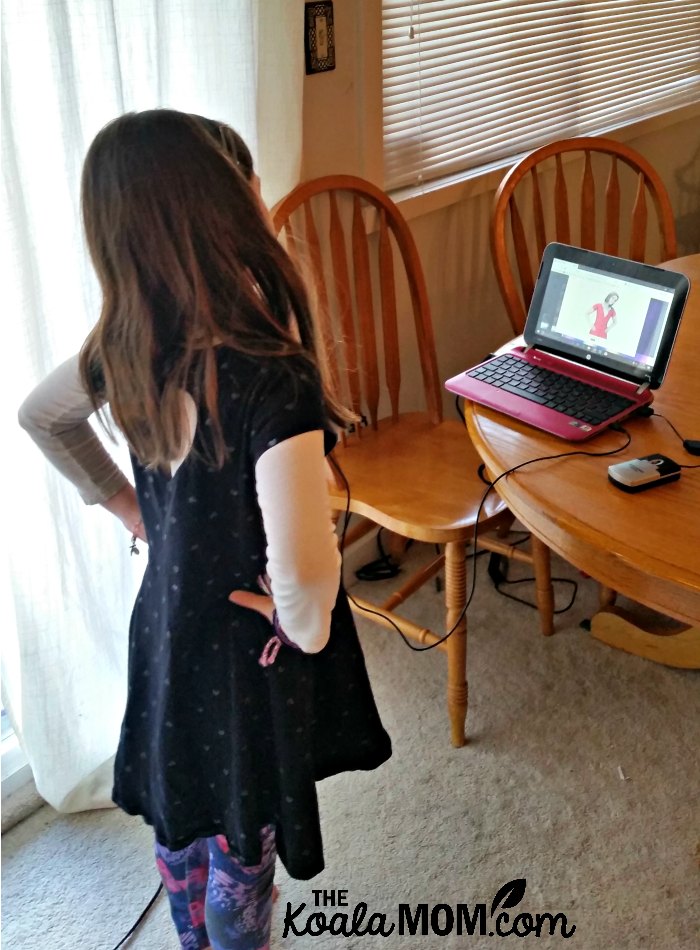 Sunshine doing a stretch break during her keyboarding lesson with UltraKey Online from Bytes of Learning