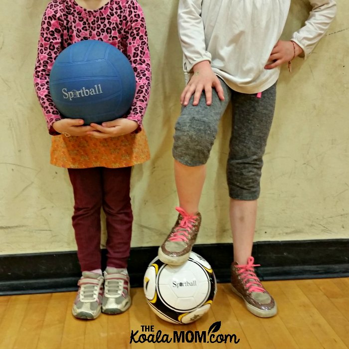 Two girls holding Sportball balls.