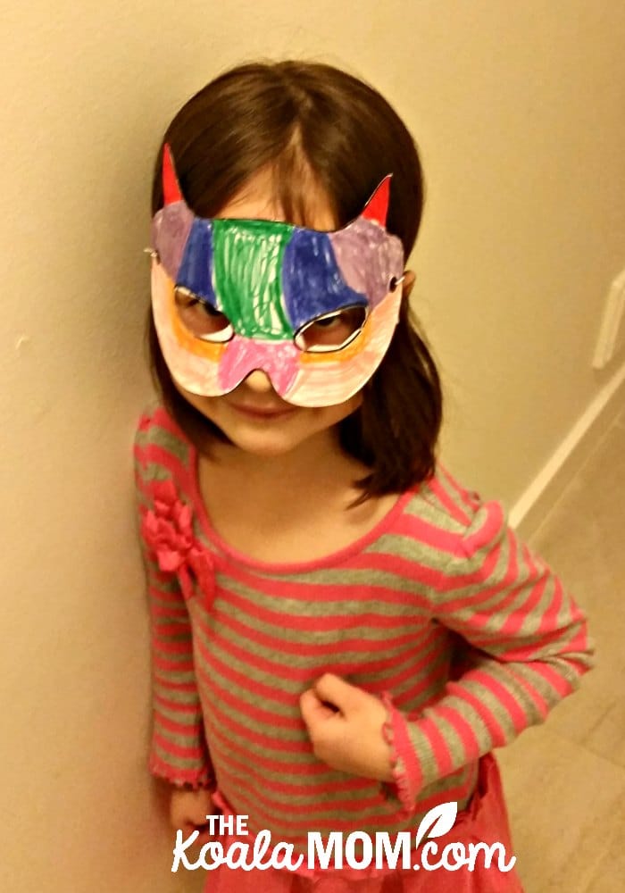 Jade wearing her multi-coloured superhero mask from her My FUNvelope kids crafts subscription