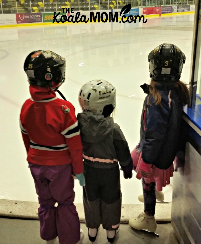 Sunshine, Jade and Lily waiting to go on the ice for their skating lessons, because I booked activities for multiple kids at the same time.