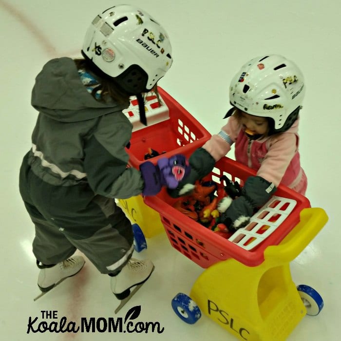 Jade (age 4) and Pearl (age 2) play together at the skating rink.