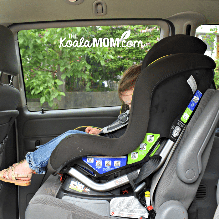 Side view of the Britax Emblem convertible car seat installed in a minivan.