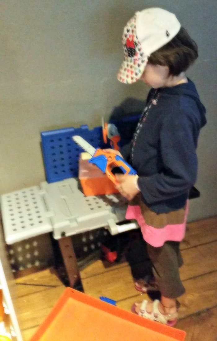 Lily plays with a toy toolbox in the kids' play area at the Blenheim Pub in Vancouver, BC