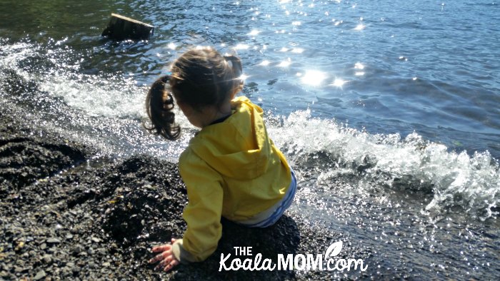 Two-year-old Pearl plays at the beach at Cultus Lake.