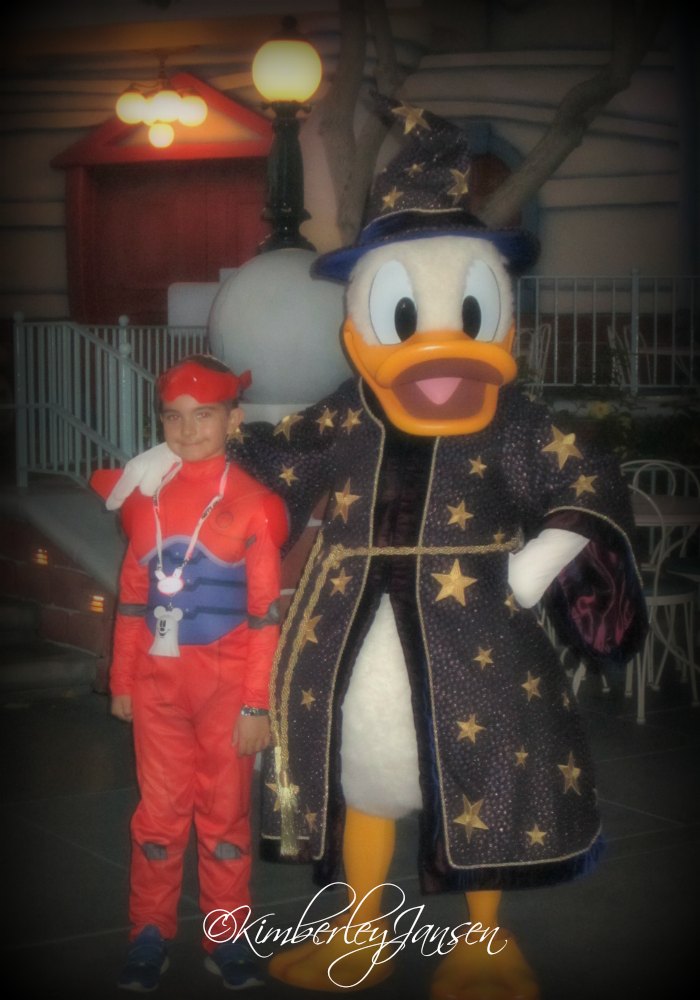 Posing with Donald Duck at Mickey's Halloween Party at the Disneyland Resort.